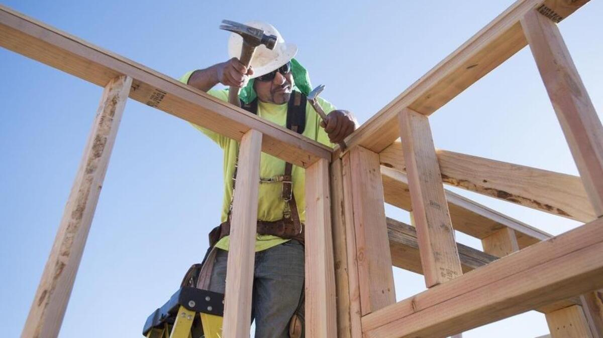 A construction worker frames a home being built by Anthem United in North Natomas on Thursday, July 13, 2017 in Sacramento, Calif.