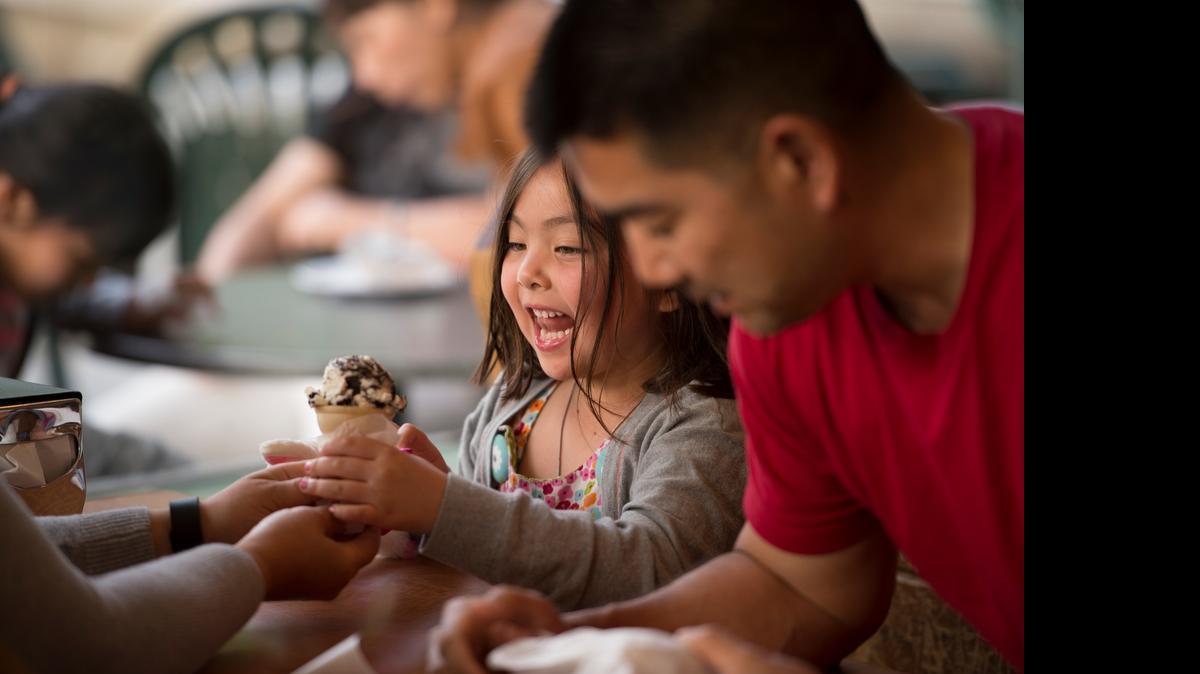 Madelyn Ogata, 5, eats her cookies-and-cream ice cream with her father, Jayson Ogata of Greenhaven, at Gunther’s Ice Cream in Sacramento.