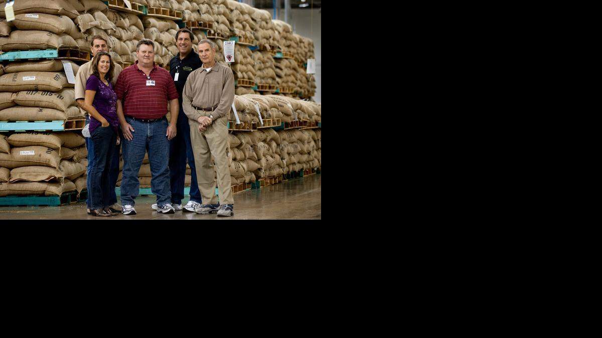 
Pete Rogers, left, his wife Kirsten Rogers, brothers Jim Rogers and John Rogers, and father Jon Rogers stand in the family’s coffee roasting facility in Lincoln in 2009.


