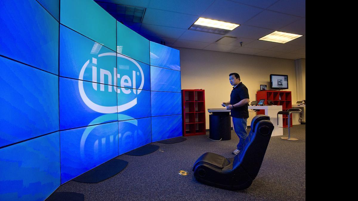 A tech researcher operates a large monitor array at the Intel facility in Folsom in 2014. The company confirmed it is listing the real estate of its campus for sale and plans to lease back part of the space, following hundreds of layoffs earlier in 2024.