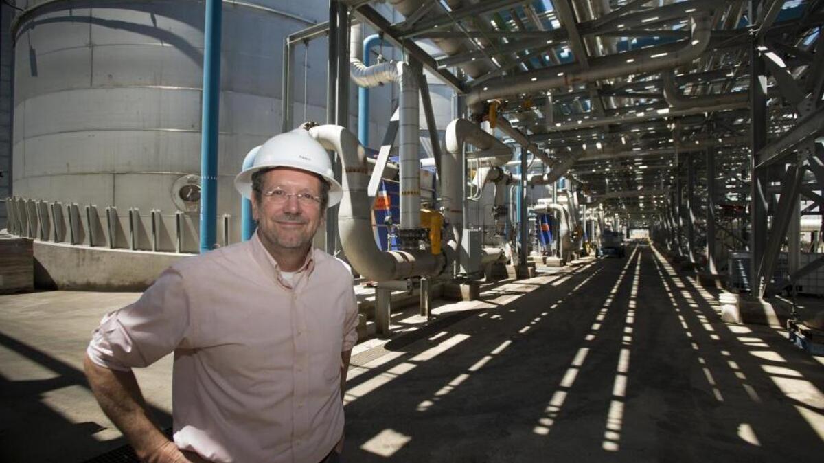 Pacific Ethanol CEO and founder Neil Koehler in front of fermentation tanks and pipes along what they call "fermentation alley" at the company's plant in Stockton, Calif., on Thursday, June 19, 2014.
