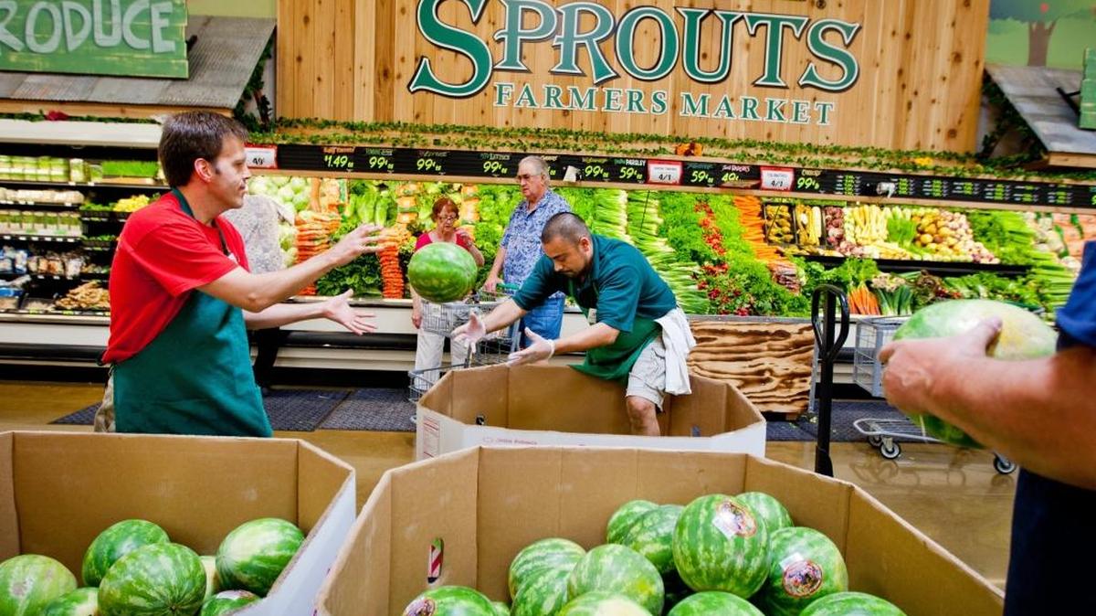 Richard Ross and Augustine Grine work in the produce department of Sprouts Farmers Market in Roseville in 2011. Sprouts is hiring for its new North Natomas store, scheduled to open Jan. 31.