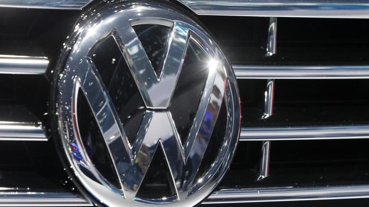 In this Sept. 22, 2015, file photo, the Volkswagen logo of a car is photographed during a car show in Frankfurt, Germany. (AP Photo/Michael Probst, File)