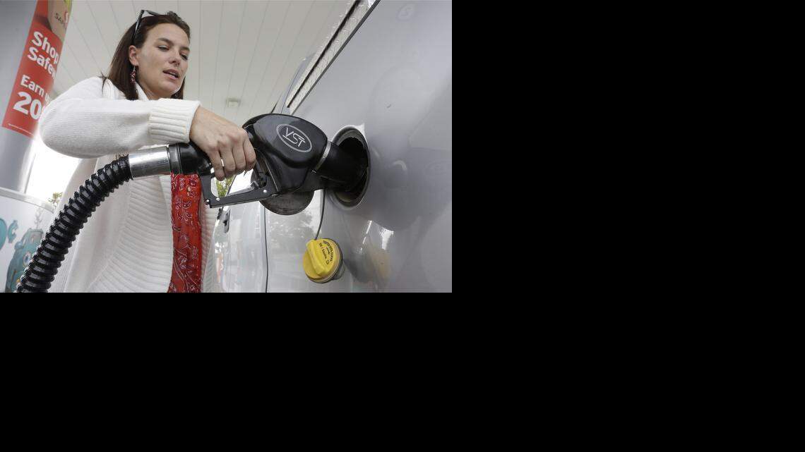 
Lydia Holland fills up at a gas station in Sacramento. Rising wholesale gas costs are only part of the story in California. Prices will be impacted by factors that include refinery maintenance, ramped-up production of pricier spring/summer gasoline blends at refineries and perhaps even the United Steelworkers union strike, said Allison Mac, a GasBuddy analyst.
