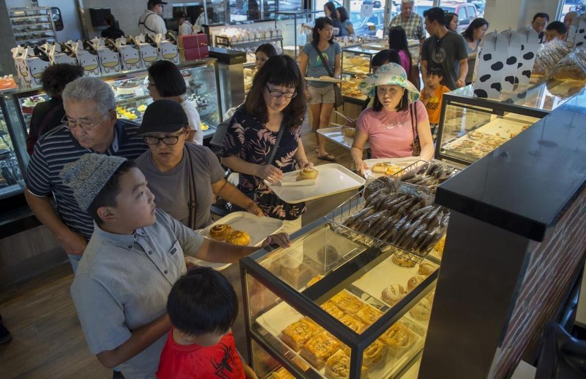 During its soft opening on Monday, July 3, 2017, patrons flock to 85°C Bakery Cafe in south Sacramento. Nicknamed the “Starbucks of Taiwan,” 85°C is known for its large variety of freshly baked breads and cakes, along with specialty drinks like sea salt coffee.