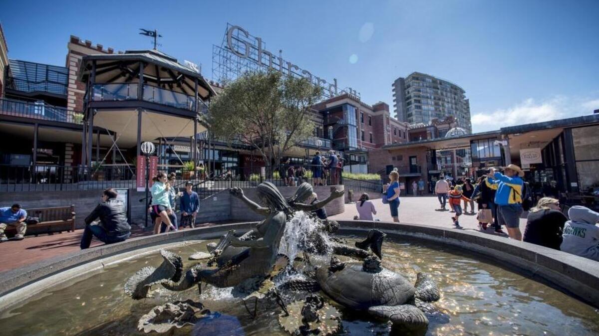 People gather at Andrea’s Fountain, the centerpiece of Ghirardelli Square in Fisherman’s Wharf in San Francisco. Traveler spending injected a record $126 billion into California’s economy in 2016, Visit California said Thursday.