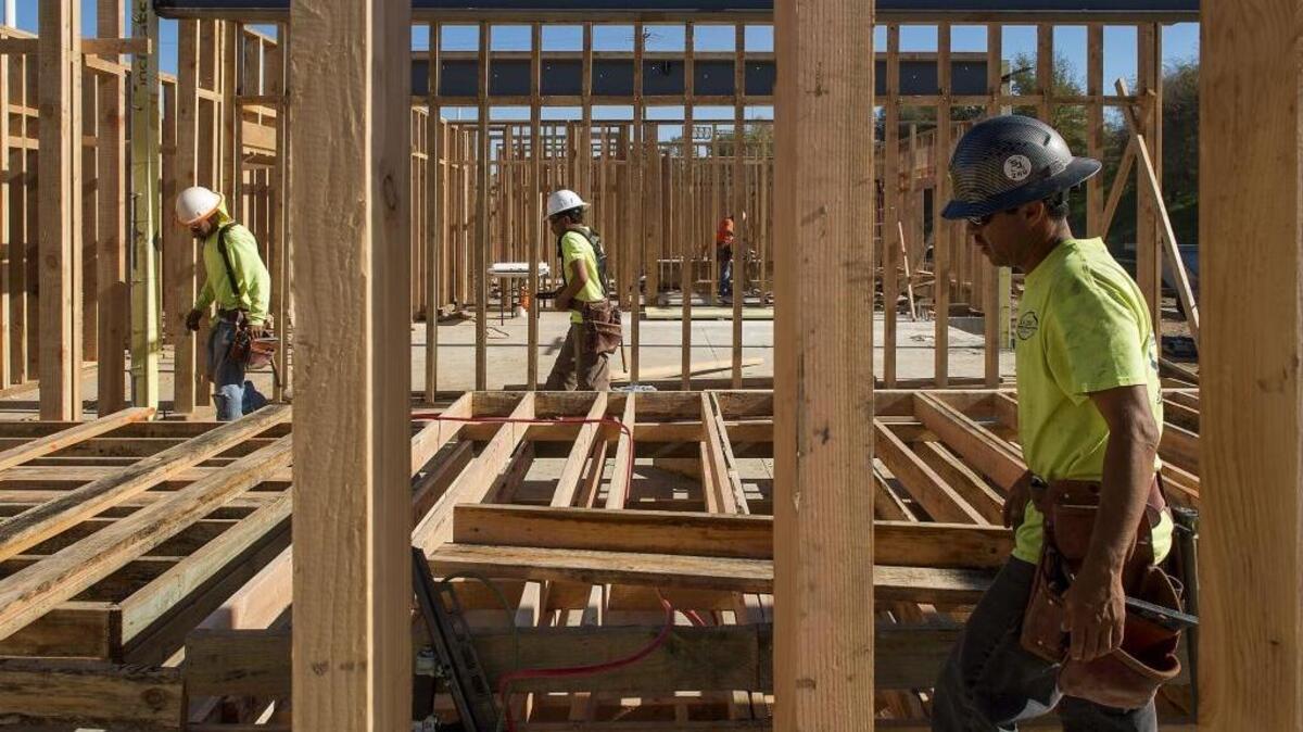 Construction crews work on the new Hampton Inn on 65th Street near Highway 50 in Sacramento on Wednesday, Nov. 9, 2016.