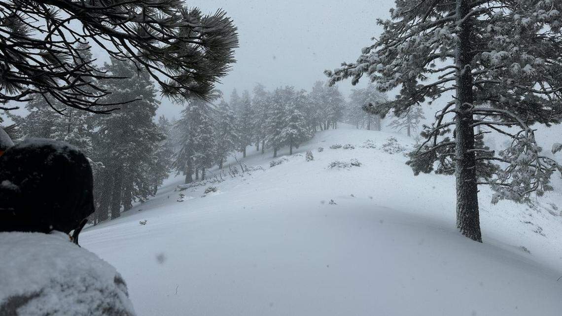 Three lost hikers were rescued Feb. 5 from Mount Baldy in California, deputies said. Researchers trekked through rain and snow before reaching them.