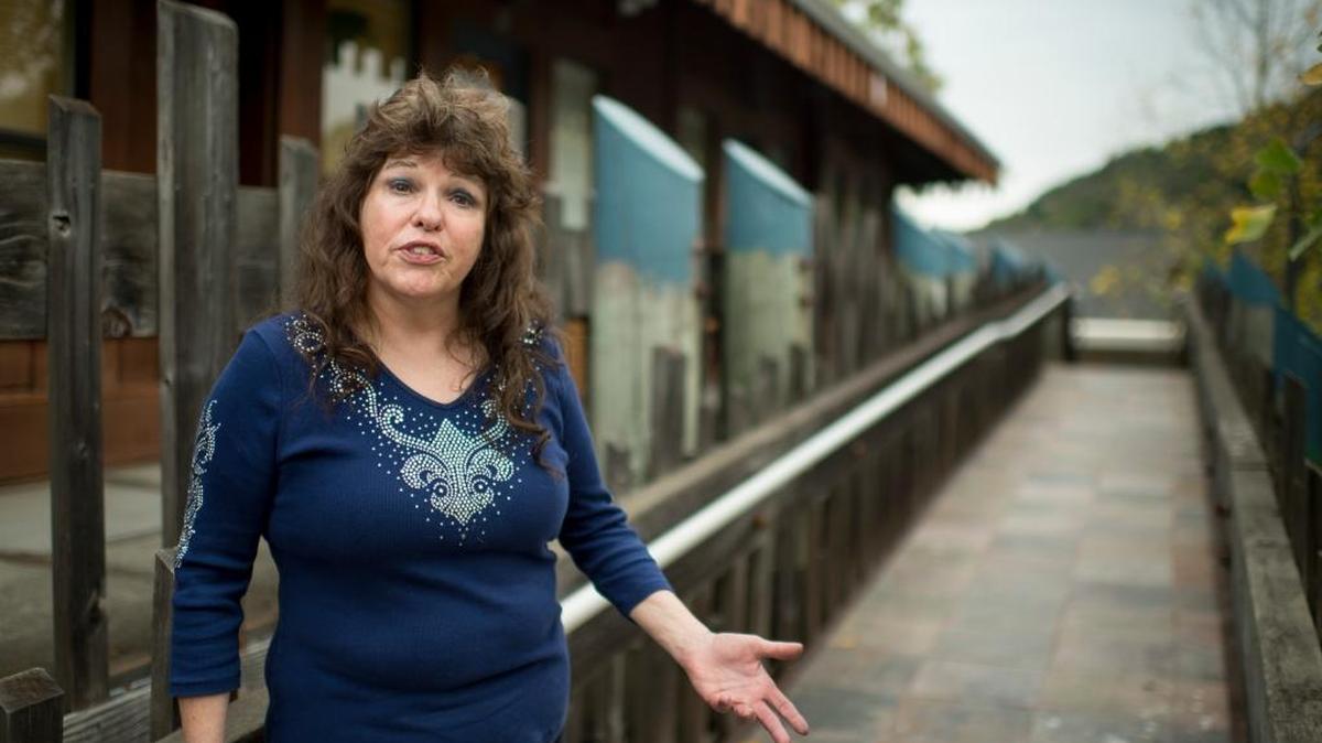Lynnette Shaw, founder of the Marin Alliance for Medical Marijuana, stands in front of the building in Fairfax that housed her medical cannabis dispensary for 16 years. A threatened property seizure forced Shaw’s dispensary to close. But last week, a federal judge sided with Shaw.