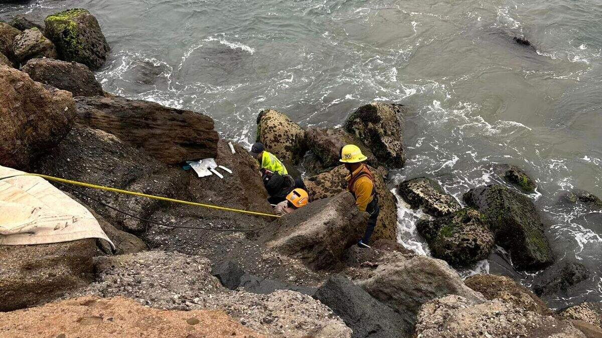 First responders rescued an angler who fell over a ledge and landed on slick rocks 30 feet below.