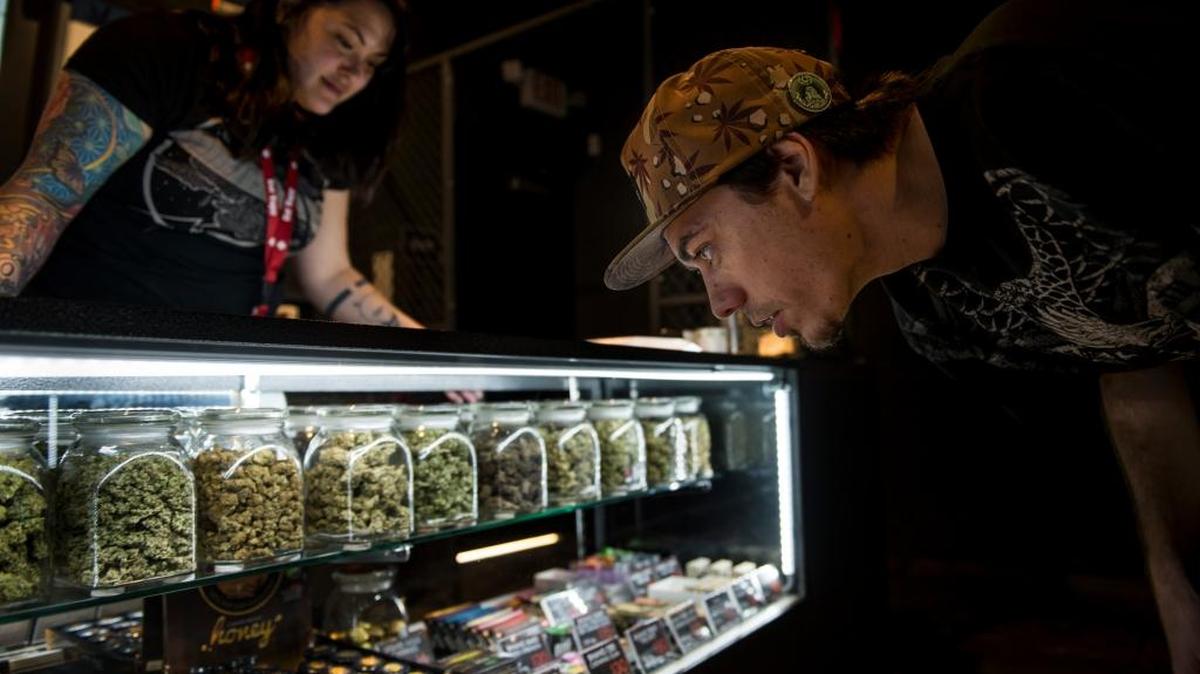 A customer browses products in February at the Orange County Cannabis Club, a medical pot dispensary in Santa Ana. California voters legalized marijuana for recreational use Nov. 8, but it could be months before the state has regulations in place for legal retail sales.