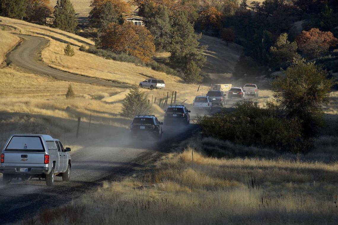 A convoy of vehicles from CHP, Siskiyou County Sheriff's Department, and National Guard, approach a property to conduct a raid on an illegal cannabis cultivation in northern Siskiyou County on Thursday, October 26, 2017. Siskiyou County Sheriff Jon E. Lopey says his war against outlaw pot growers has escalated into a "national emergency.”