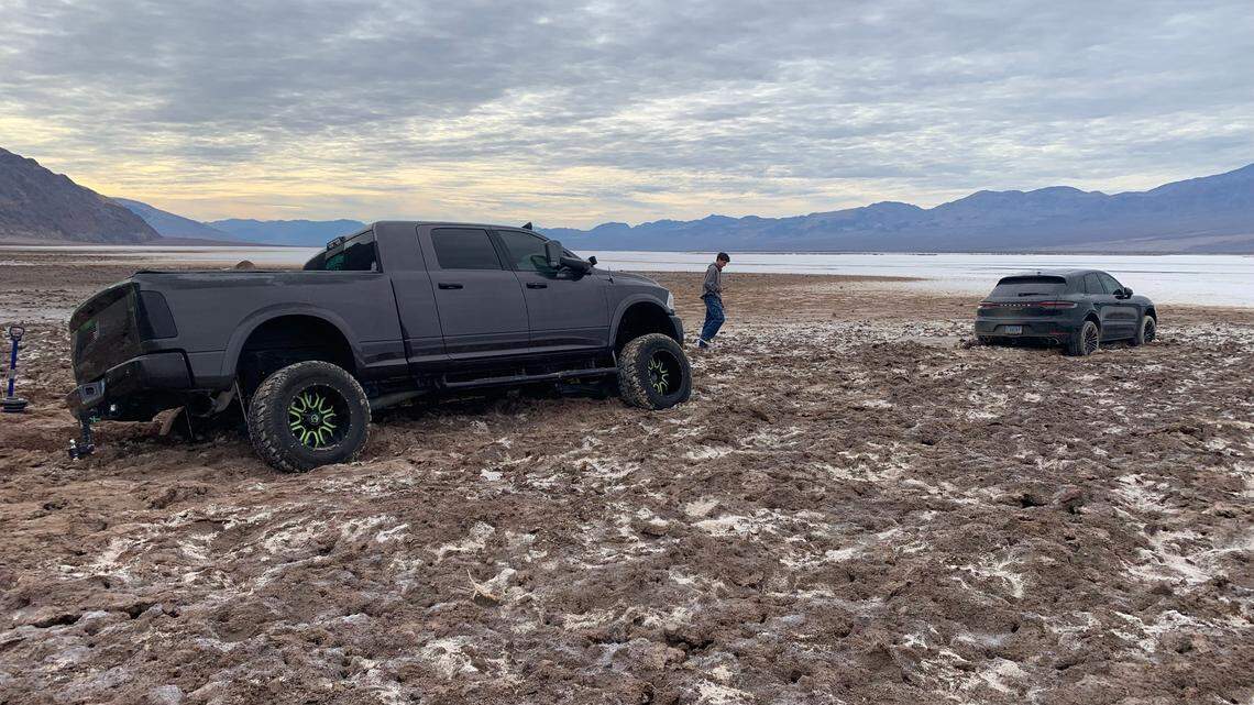 A Porsche SUV became stuck in the mud in Death Valley National Park after illegally off-roading, rangers said. A truck also became stuck when the driver tried to tow the SUV.