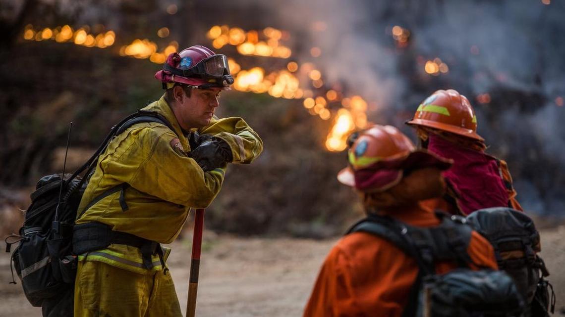 A firefighter with Cal Fire chats with crew members of California Department of Corrections at the The Butte Fire last season. Cal Fire already has responded to 240 wildfires since Jan. 1, 2016 and has boosted its staffing by 400 seasonal firefighters statewide. The additional crews will focus on fire prevention, fuel reduction and defensible space programs.