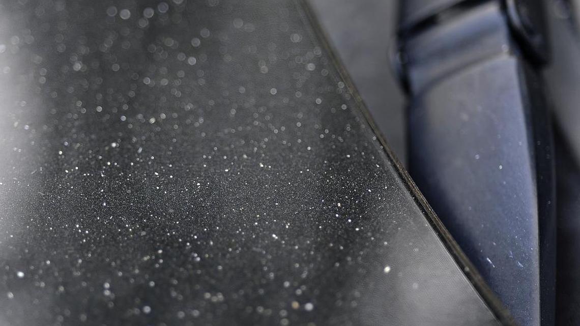 
A layer of fine, white ash from the Rough Fire, covers a car in Clovis on Friday morning.
