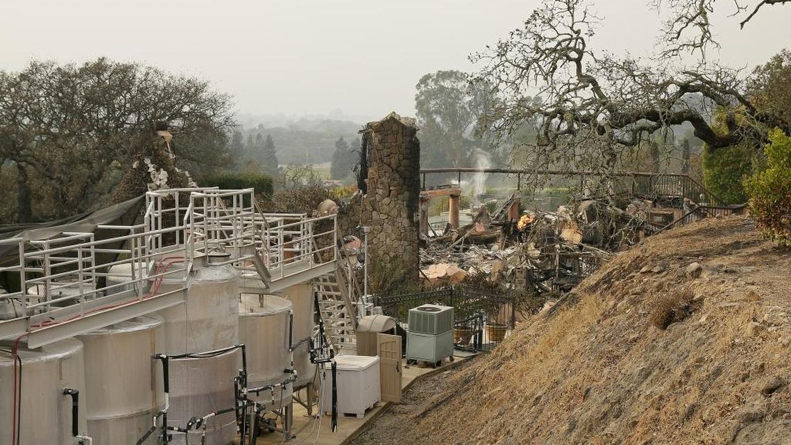 Fermentation tanks still stand next to the burned remains of the Signorello Estate winery Tuesday in Napa. Worried California vintners surveyed the damage to their vineyards and wineries Tuesday after wildfires swept through several counties whose famous names have become synonymous with fine food and drink.
