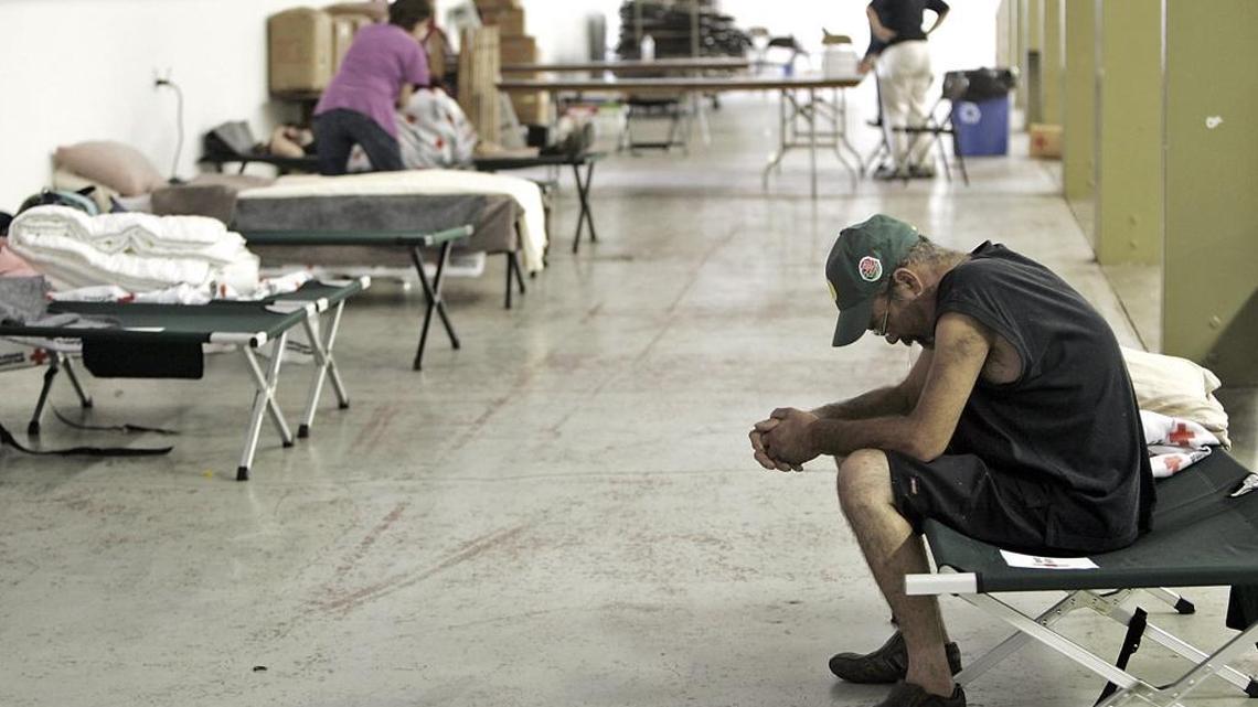 
On Sunday, Sept. 13, 2015, a man sits on a cot in an evacuation center at the Napa Valley Fairgrounds in Calistoga, Calif., after the Valley fire forced him and many other people from their homes. Resources have emerged to provide help for victims of the Valley fire and the Butte fire burning in Amador and Calaveras counties.
