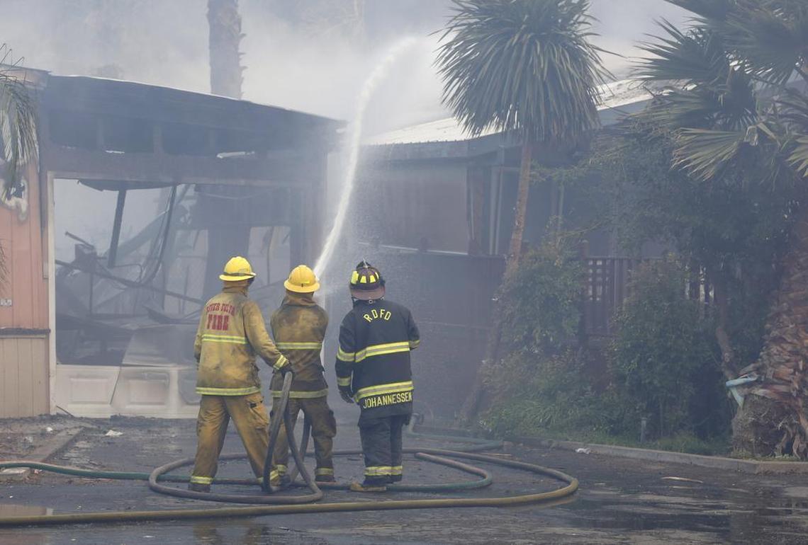 Firefighters put water on a burning mobile home at Korth’s Pirate’s Lair Marina in Isleton in July 2015. Measure B was a special sales tax approved by voters in 2016 to fund fire services.