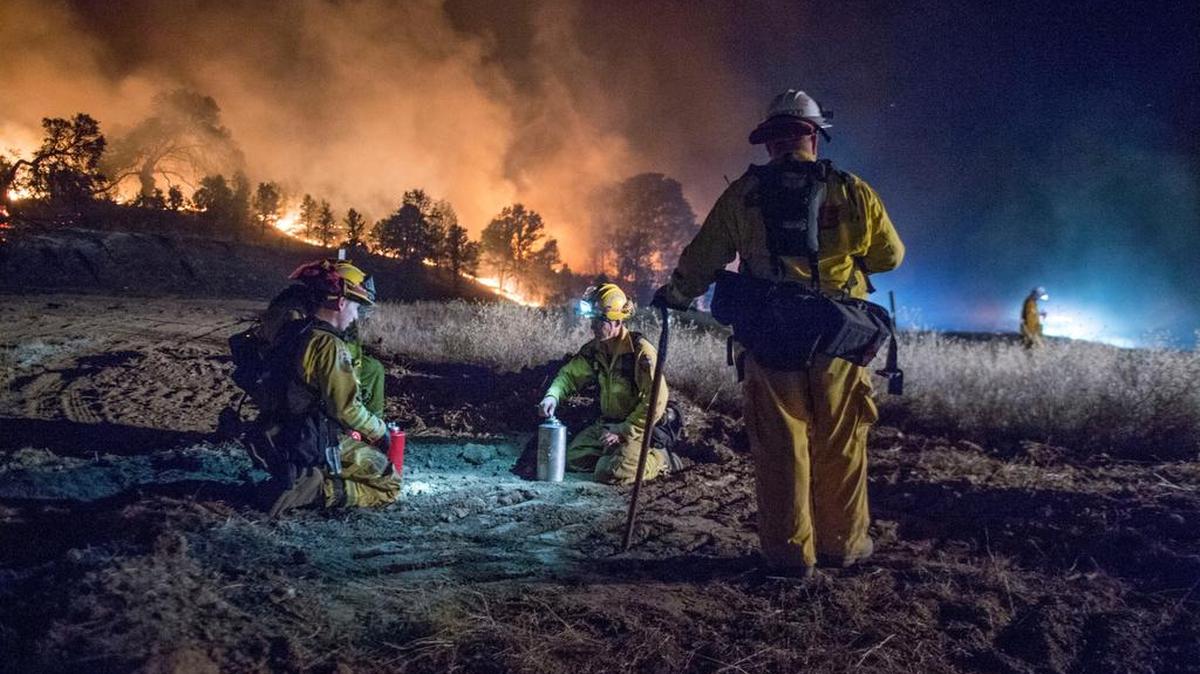 
Cal Fire crews work on the the Rocky fire near Clearlake on Monday. By Tuesday, the fire had burned 67,000 acres after jumping Highway 20 on Monday.
