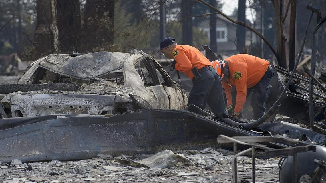 Search and Rescue crews from Alameda County search through the rubble in the Coffey Park area of Santa Rosa on Oct. 17.