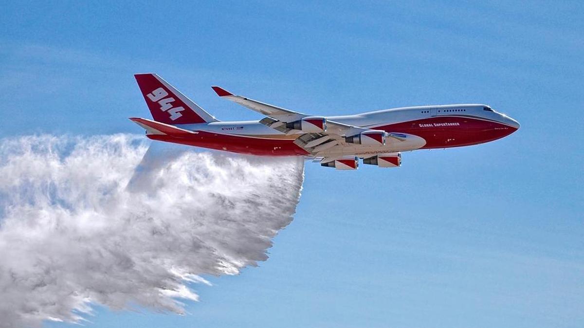 FILE - This May 5, 2016, file photo provided by Global Supertanker Services shows a Boeing 747 making a demonstration water drop at Colorado Springs Airport in Colorado Springs, Colo. Federal officials have given a giant airtanker capable of carrying 19,200 gallons (72,700 liters) approval to fight wildfires in the U.S., but a lack of contracts currently limits the aircraft to California and one county in Colorado. The U.S. Department of Agriculture's Interagency Airtanker Board issued the approval on Tuesday, July 25, 2017.