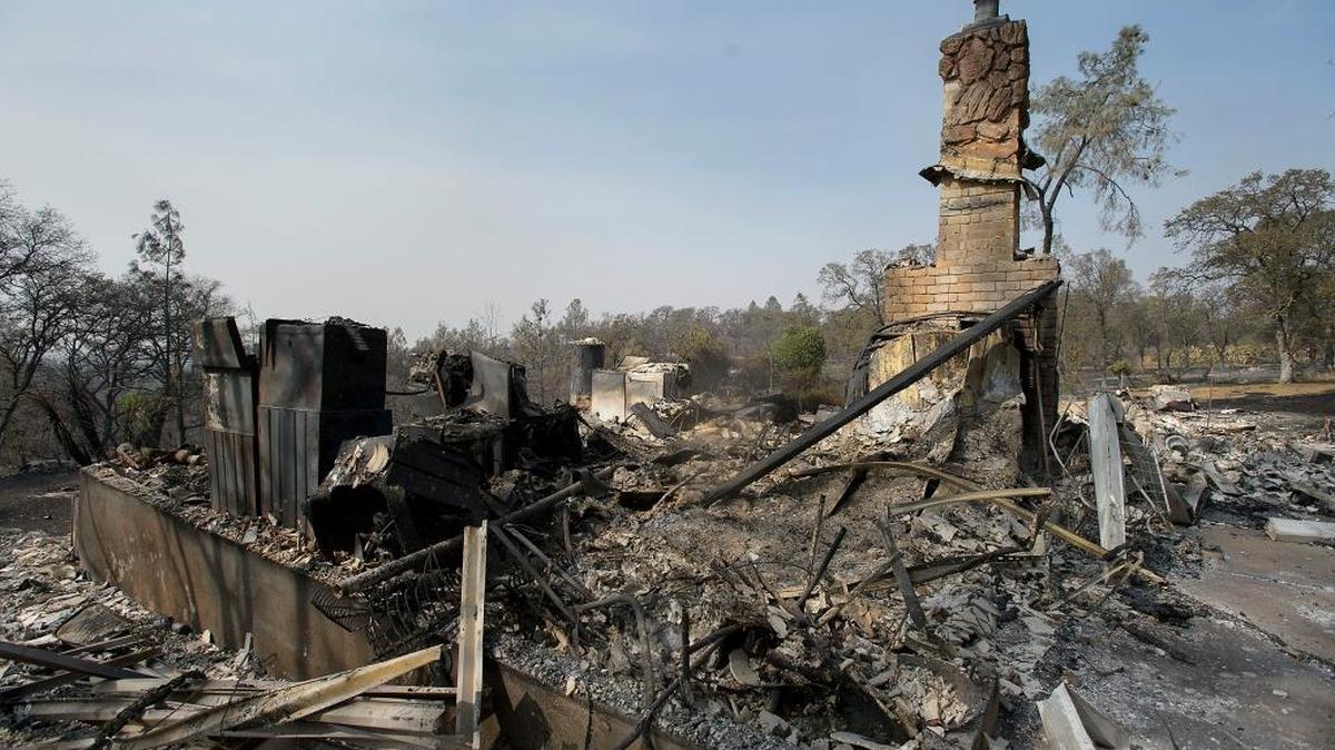 Very little remains of a structure on a property along Lone Tree Road near Loma Rica following the Cascade fire in Yuba County. Cal Fire on Tuesday blamed PG&E for the deadly fire.
