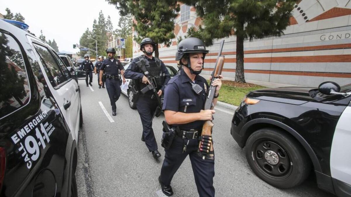 Police officers work at the scene of a fatal shooting at UCLA on Wednesday, June 1, 2016, in Los Angeles.