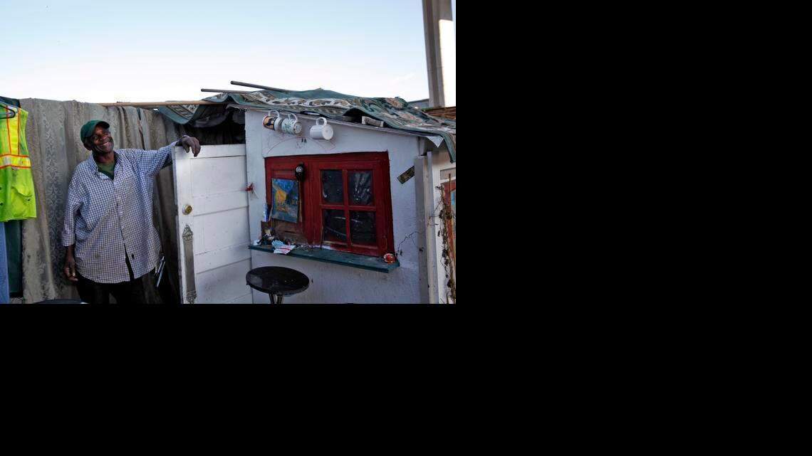 
George Clinton stands next to his house built by Greg Kloehn in Oakland.
