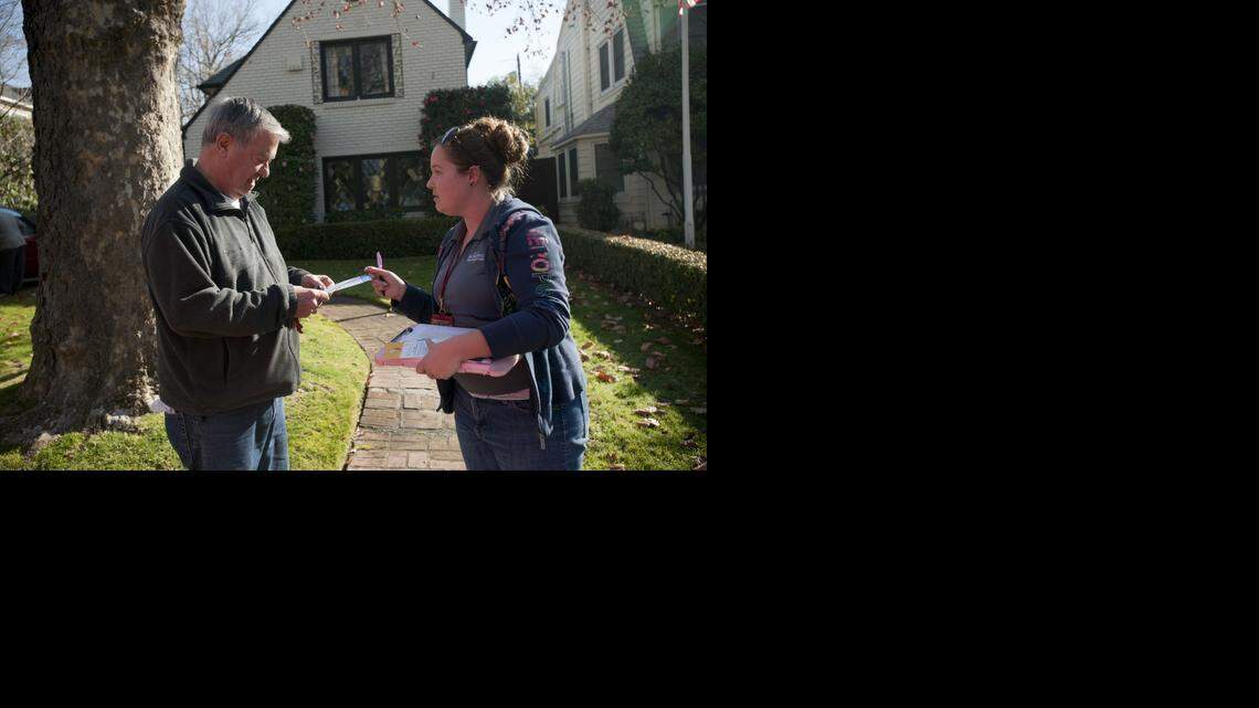 
Elizabeth McAllister, right, a water conservation specialist with the city of Sacramento, gives educational information to East Sacramento resident Larry Reagan.
