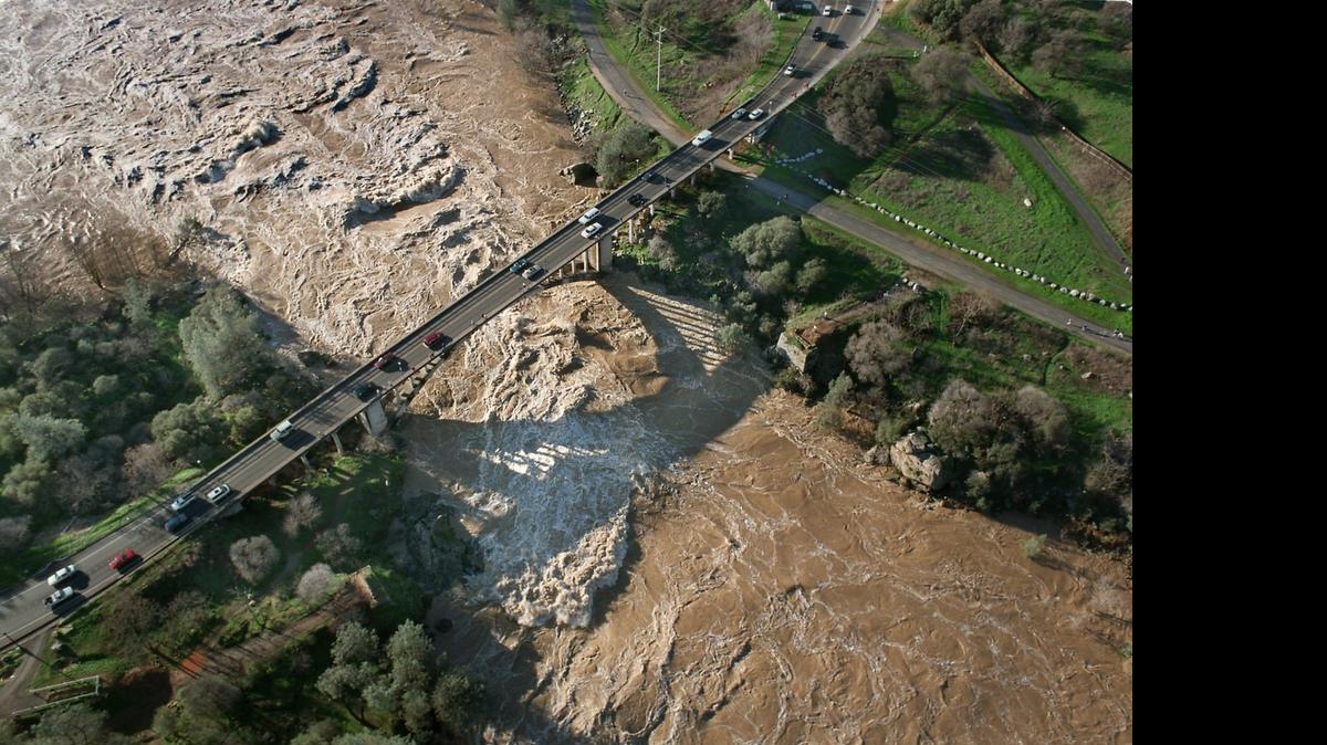 
In January 1997, a swollen American River surges under the Rainbow Bridge in Folsom. 
