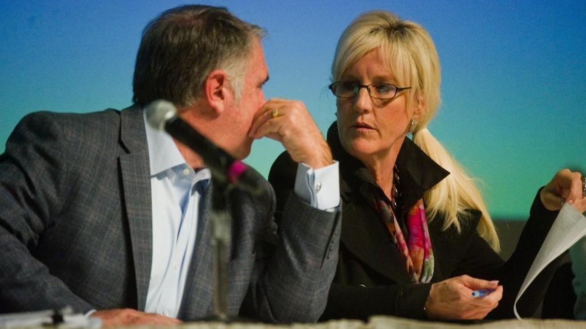 Activist Erin Brockovich, right, talks with water treatment expert Robert W. Bowcock during a community forum on drinking water safety in Stockton in 2015. California officials just eliminated the drinking water standard for chrome 6, the chemical made famous in the 2000 movie about Brockovich.