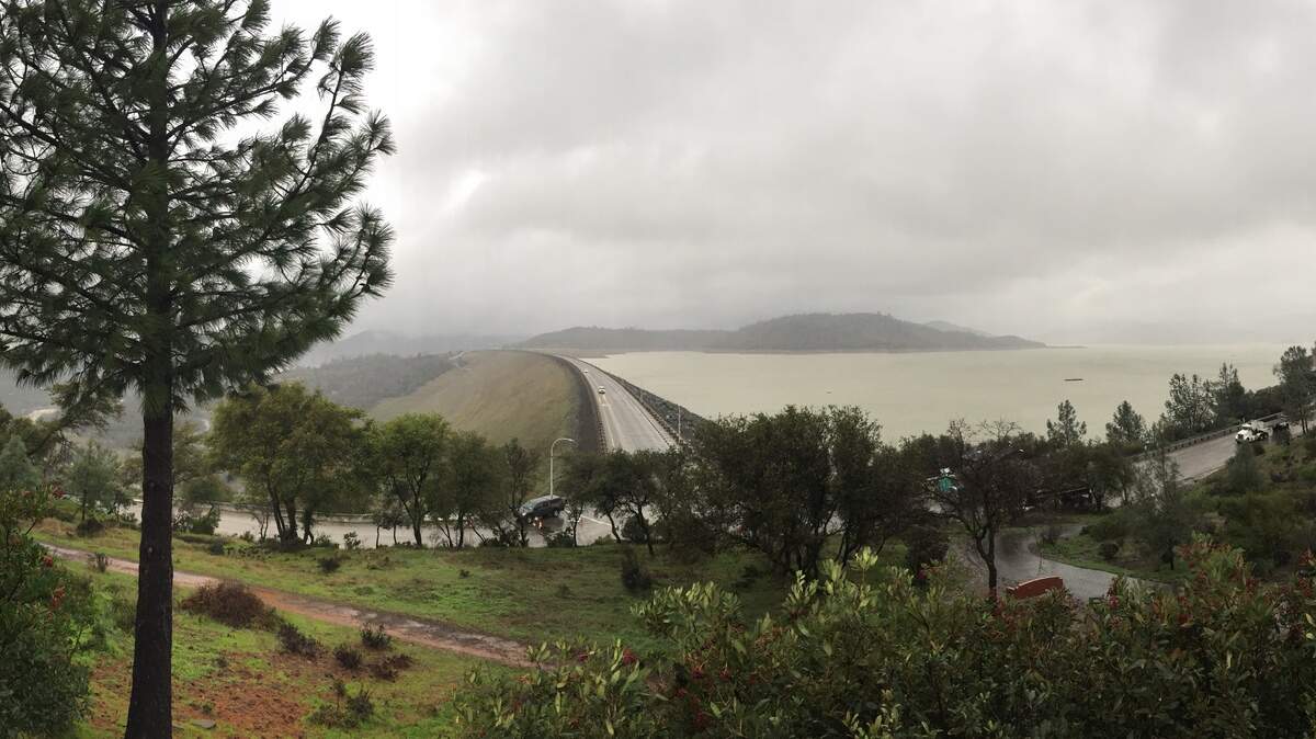 Heavy clouds enshroud Lake Oroville, Oroville Dam and the surrounding hills on Feb. 20, 2017.