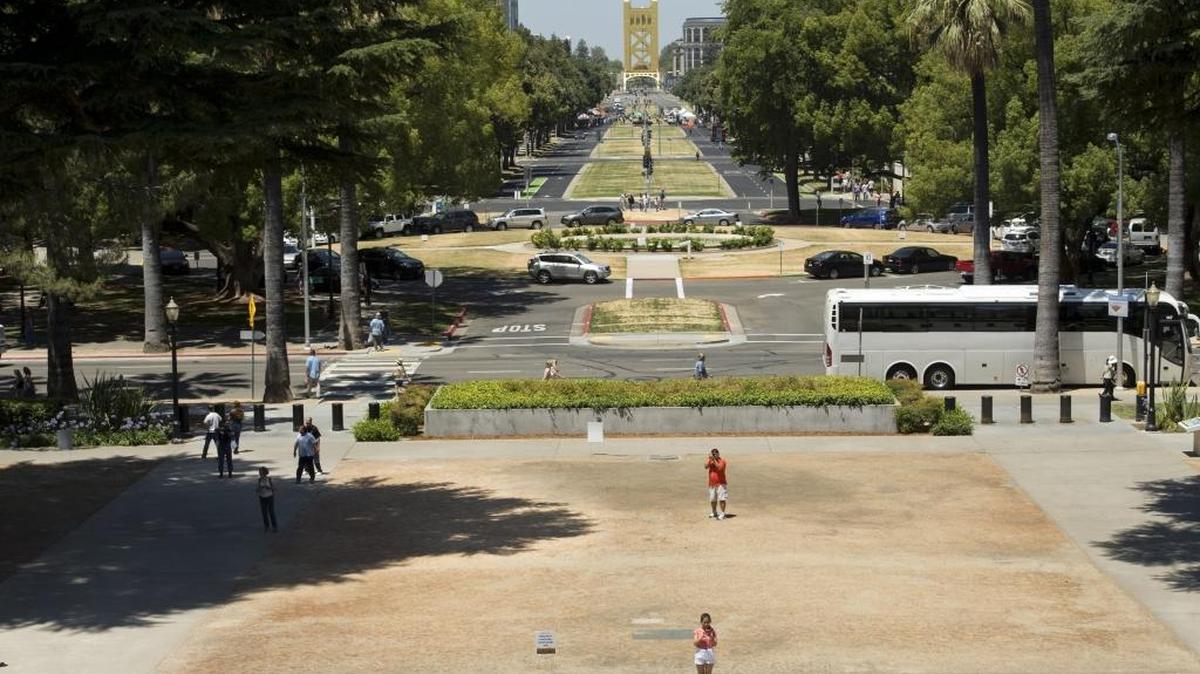 Californians can expect another year of water conservation in 2016 under an executive order issued Friday, November 13, 2015 by Gov. Jerry Brown. This July 2014 photo shows the state Capitol grounds from the west steps. State officials wanted to send a message to the public about the seriousness of the drought.