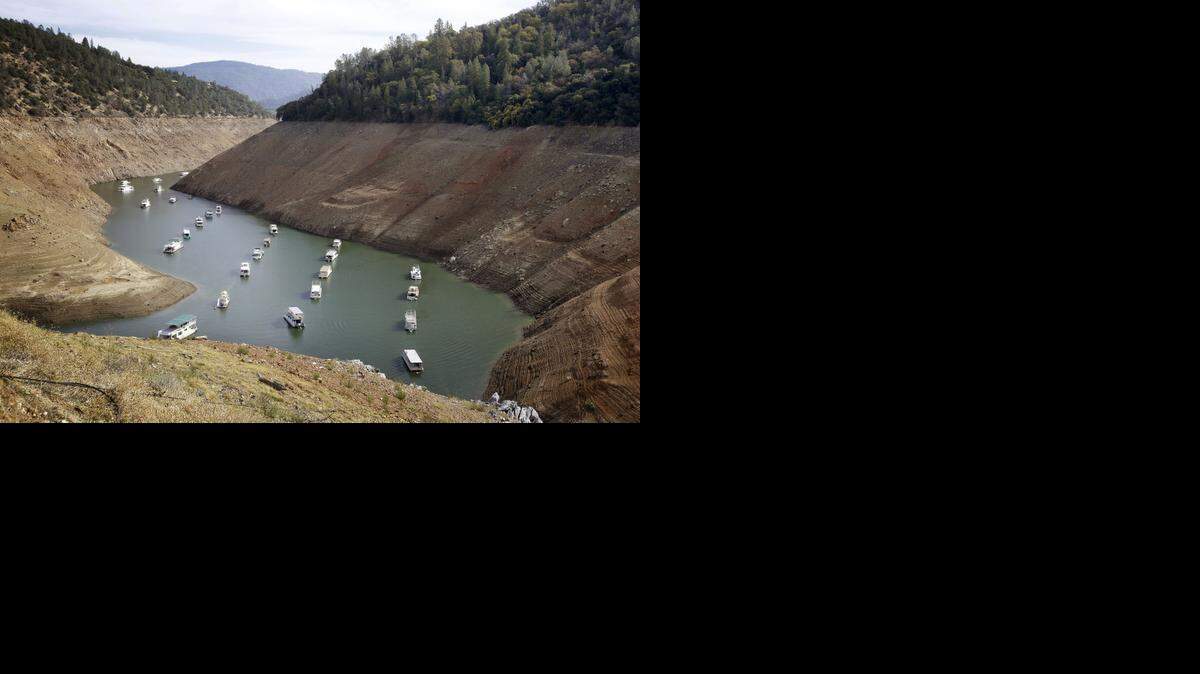 
Houseboats sit in the drought-lowered waters of Oroville Lake near Oroville in October.
