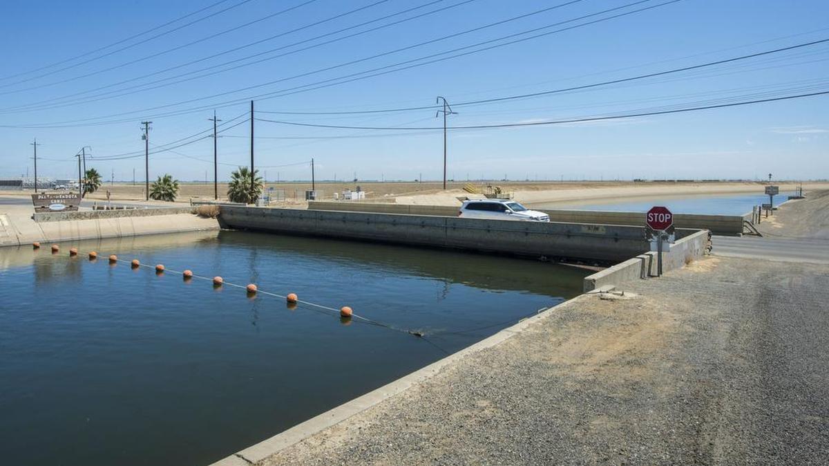 
This July 23, 2015, photo provided by the California Department of Water Resources shows the Russell Avenue bridge over the Delta Mendota Canal in Firebaugh. The drought has caused the bridge to subside until there’s almost no space between the bottom of the bridge decking and the canal water surface. A NASA scientist says in a report released Wednesday, Aug. 19, 2015, that parts of California’s Central Valley are sinking faster than ever as groundwater is being pumped during the state’s historic drought.
