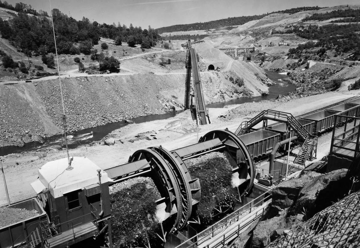 A train car dumper brings rock, dirt and other construction materials to the Oroville Dam construction site in May 1964. Dumpers could unload 10,000 tons of material each hour.