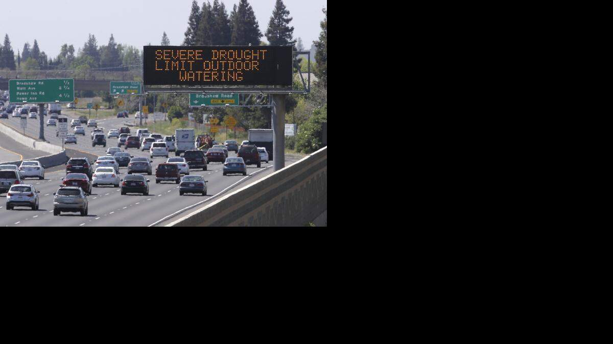 
Motorists pass a Rancho Cordova sign Thursday reminding them to reduce water use due to the statewide drought, as they drive on Highway 50. California Gov. Jerry Brown on Wednesday ordered a 25 percent overall cutback in water use by cities and towns, but not farms, in the most sweeping drought measures ever undertaken by the nation’s most populous state. 
