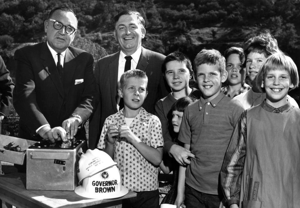 Gov. Edmund G. “Pat” Brown Sr., left, sets off the initial dynamite blast at Oroville Dam with William Warne, director of the Department of Water Resources, and students from Las Plumas Elementary School in October 1961.