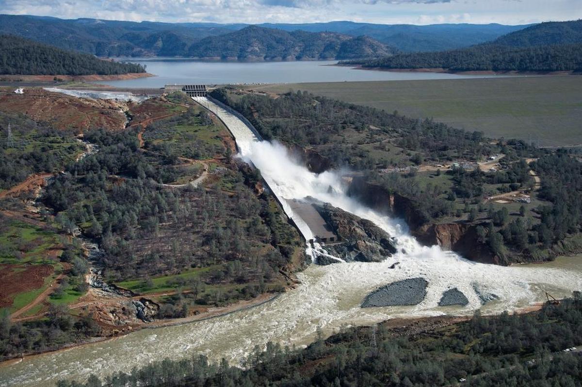 The sheer power of the water being released from Oroville Dam’s fractured main spillway is evident in this Feb. 24 aerial photo. Heavy pounding on the concrete chute left the structure a shambles.