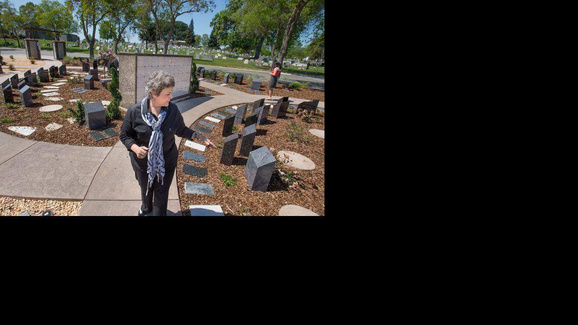 
Lisa West of Sacramento’s East Lawn Memorial Cemetery, points out drought-resistant landscaping at the El Dorado Estates area of Sierra Hills Memorial Park on Friday. Since 2013, the cemetery has watered less and, where possible, planted rock gardens and drought-resistant plants.
