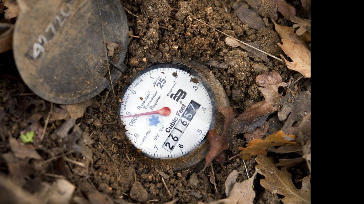 
A Placer County Water Agency meter is exposed at a home during a Water-Wise House Call on Thursday, Jan. 15, 2015 in Newcastle, Calif. 
