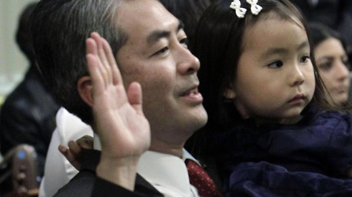 In this Dec. 3, 2012, file photo, Assemblyman Al Muratsuchi, D-Torrance, holds his daughter, Sophia, as he is sworn in at the Capitol in Sacramento, Calif. Muratsuchi lost in 2014 but regained his seat last month with the help of millions from Democratic Party committees.