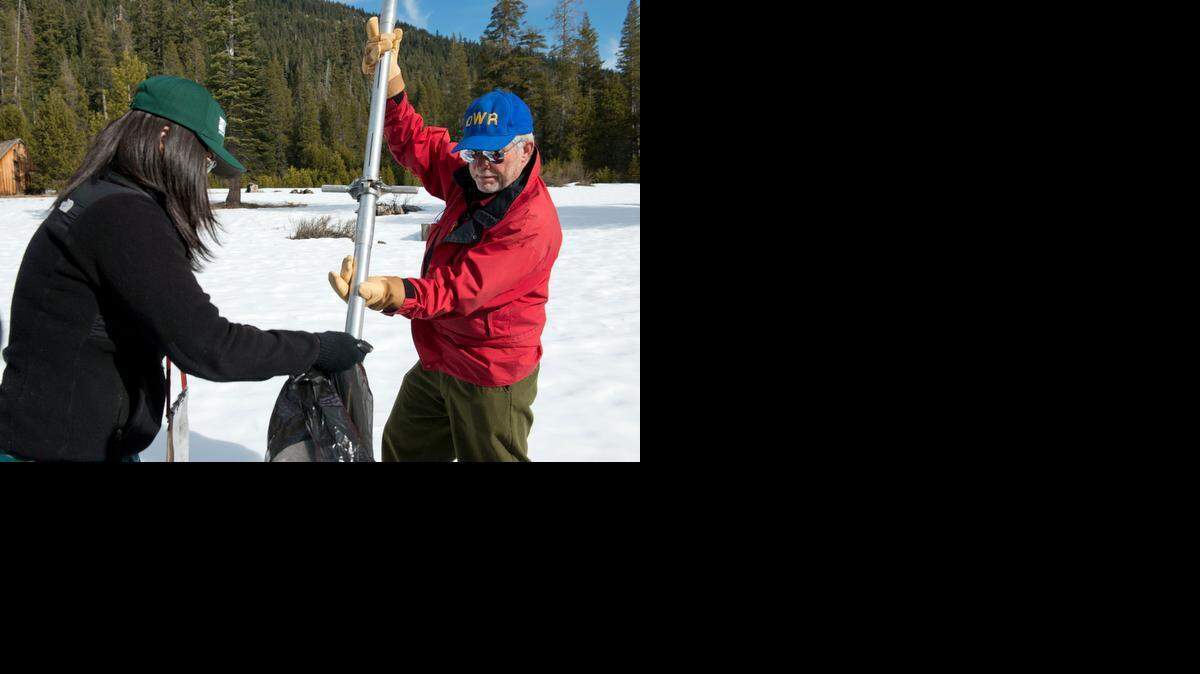 
Frank Gehrke, chief of California Cooperative Snow Surveys Program and Michelle Stern, with the U.S. Geological Survey, bag snow samples Thursday.
