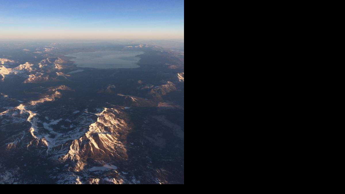 
Snow is scarce in the mountains around Lake Tahoe on Feb. 25. The Sierra Nevada’s snowpack delivers about 60 percent of the freshwater Californians use in their homes, businesses and farms. But more winter precipitation is falling on the Sierra as rain rather than snow, which changes the duration and intensity of runoff. 
