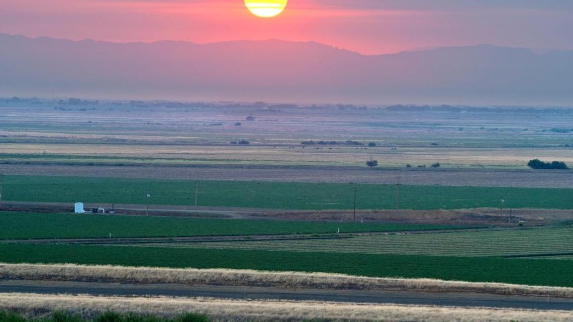 The sun rises as water is delivered to crops in Fresno County, which is included as the hot inland regions that will take a beating according to groundbreaking climate change study published in the journal Science. Global warming will punish some areas of the country more severely than others. The same factors will play out in California. Coastal regions, where much of California’s wealth is concentrated, will be somewhat buffered because of the breezy ocean climate.