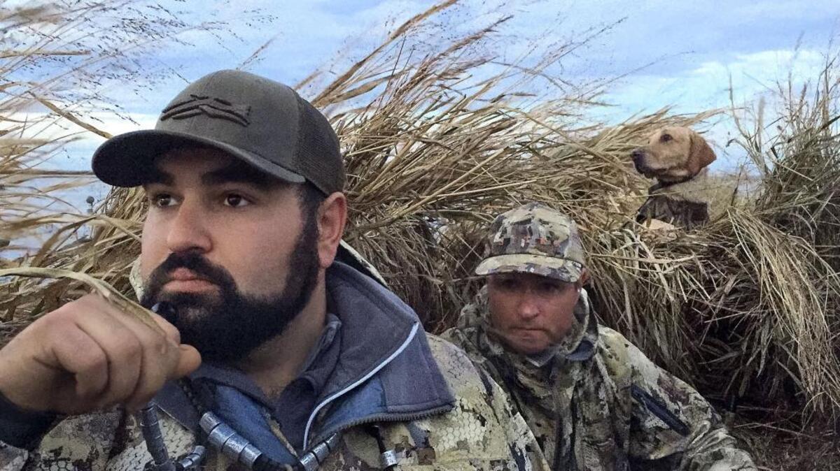 Christopher Tocatlian, a hunting guide for River Valley Outfitters, prepares to call ducks for his client, Al Balzer of Los Gatos. Gov. Jerry Brown appointed two new members to the Fish and Game Commission, which regulates hunting and fishing.