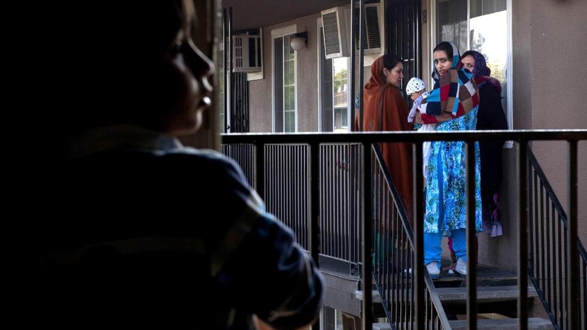 Skyview Villa apartments in Arden Arcade, where Malalai Rafi, far right, joins other Afghan women to bid good-bye to a family moving out in November, is one of several complexes that have problems with bedbugs, roaches and potentially life-threatening dry rot. The Bee series, “No Safe Place,” documented how former interpreters and other Afghans who worked alongside U.S. forces in the war have been placed in run-down apartments in Sacramento.