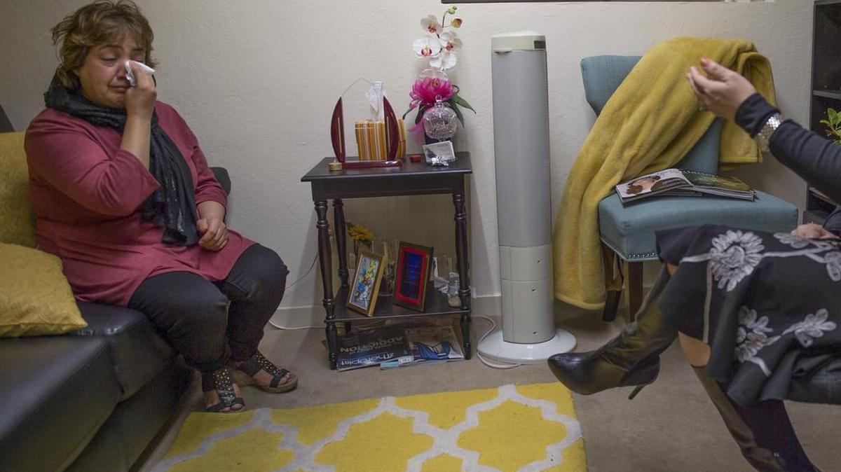 Shukriya Karimi, 36, wipes tears in her therapy session with Homeyra Ghaffari as she talks about her sons she had to leave behind in Afghanistan on Wed., Nov. 2, 2016 in Sacramento. Her estranged SIV husband only allowed her to bring two of her four children from Afghanistan. “Shukriya was suicidal and has hallucinations from a head injury caused by domestic violence back home,” said Ghaffari, who gave the family about $2000 to send to the brothers in Afghanistan.