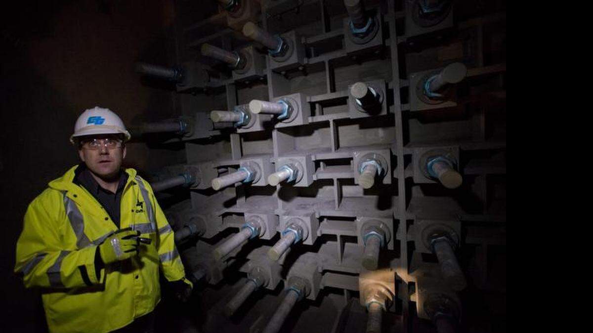 
Caltrans engineer Bill Casey shows anchor rods that secure the main cable of the new Bay Bridge suspension span in 2014. An investigation by The Bee found corrosion on some rods.
