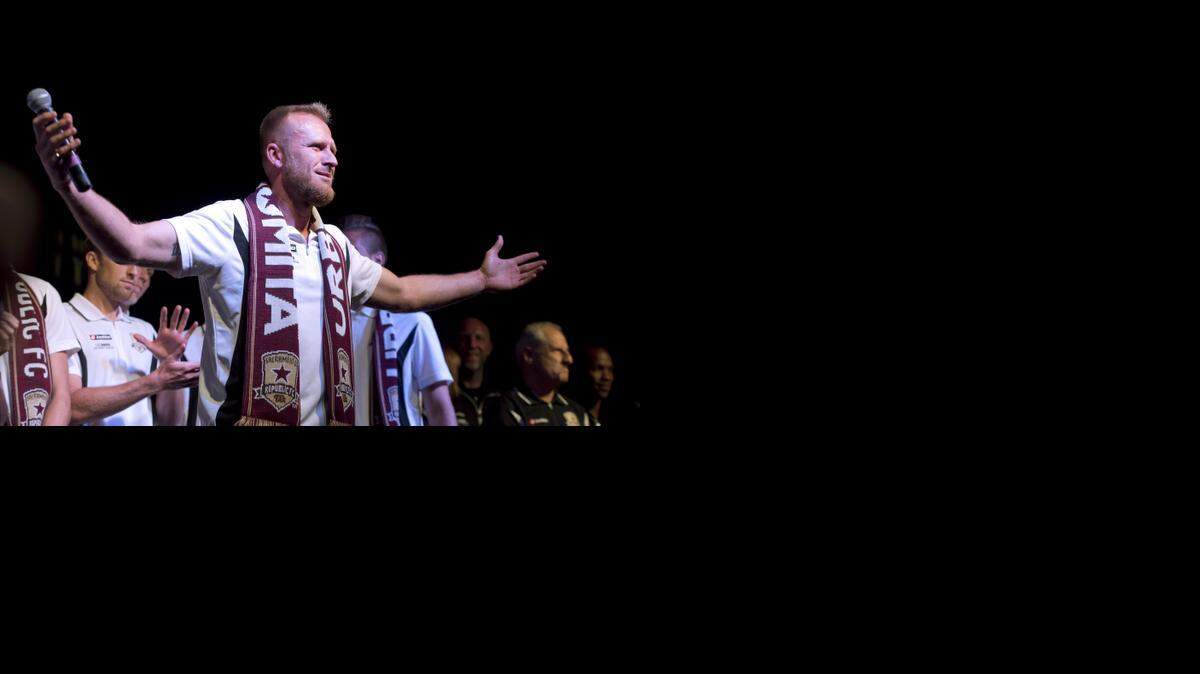 
Sacramento Republic FC player Dominik Jakubek acknowledges the crowd during the Sacramento Republic block party at 20th and K streets in September. A Major League Soccer delegation visited, and the team won the USL Pro championship game a few days later. 
